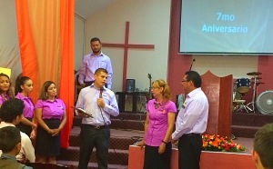 Jaime & Valentina on the far right receiving a plaque of recognition for their 7 years of ministry at the church